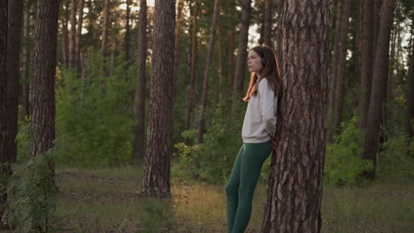 young woman relaxing in a forest