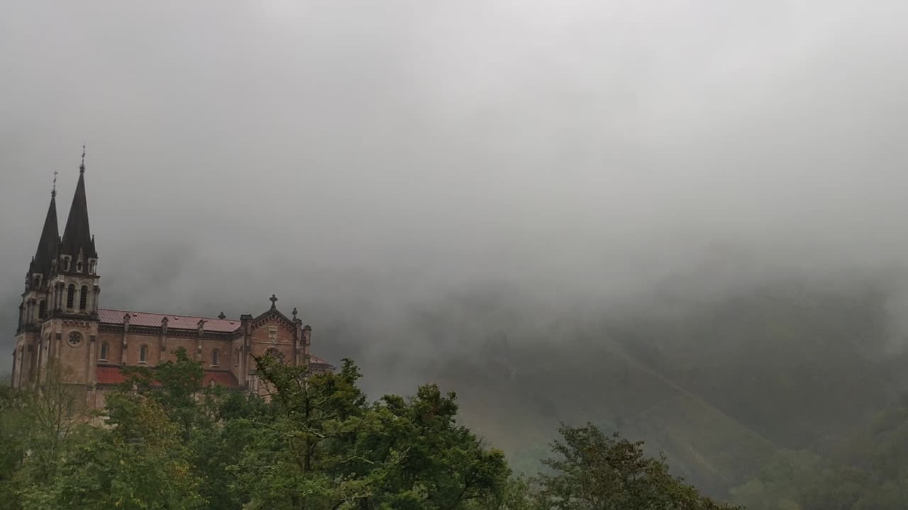 Historic basilica in misty mountain setting, Covadonga, Asturias, Spain