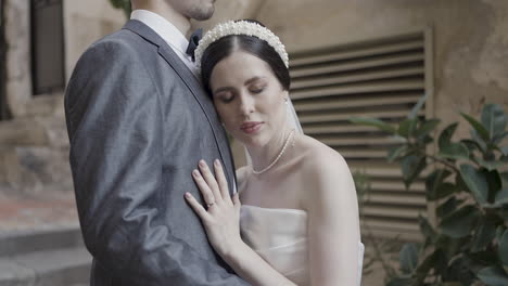 couple in love, bride leans on groom's shoulder
