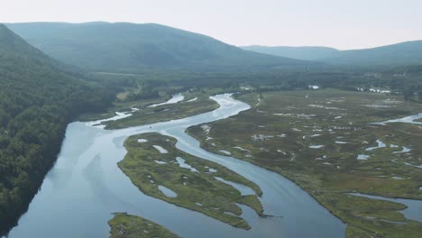 beautiful gaspe river in northern quebec by the mountains - aerial