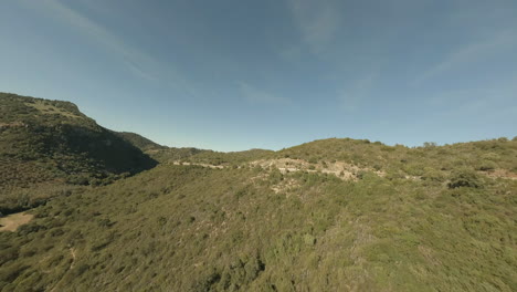 high frame rate flight near winding highway in spanish countryside