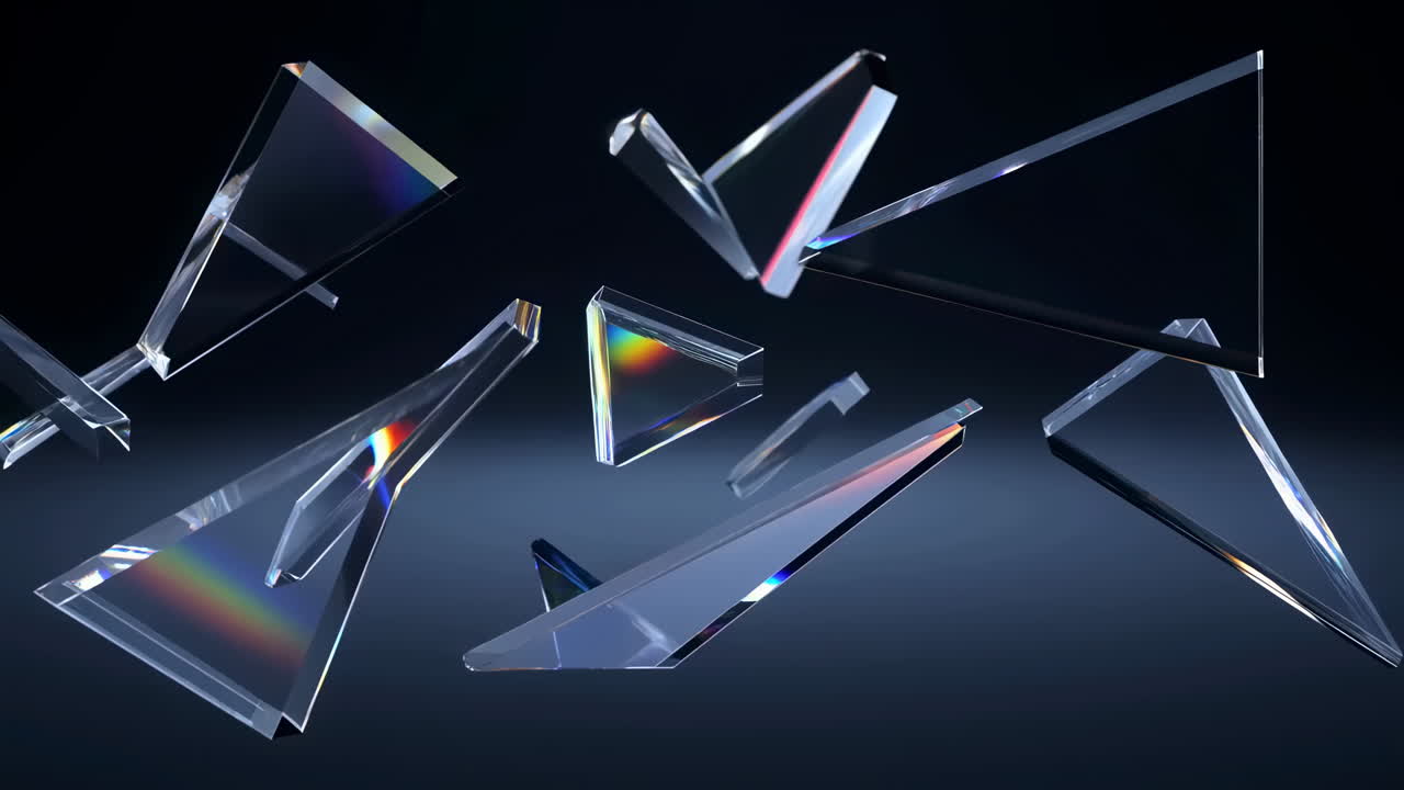 Prismi triangolari trasparenti che rifrangono la luce creando spettri arcobaleno