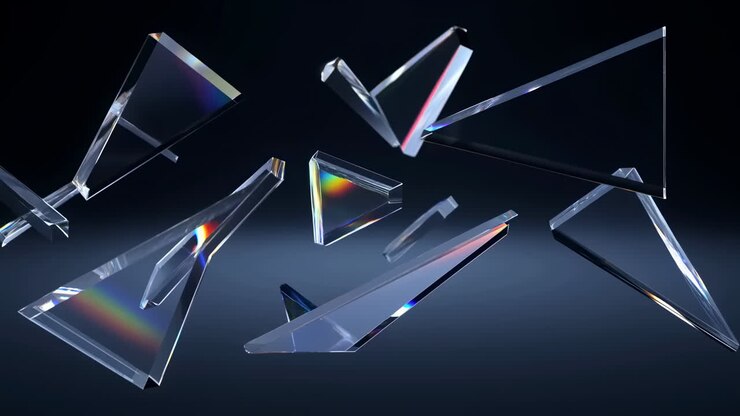 Prismi triangolari trasparenti che rifrangono la luce creando spettri arcobaleno