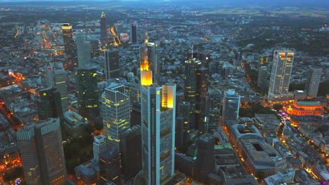 AERIAL:-View-of-Frankfurt-am-Main,-Germany-Skyline-at-Night,City-Lights,-Traffic,Movement