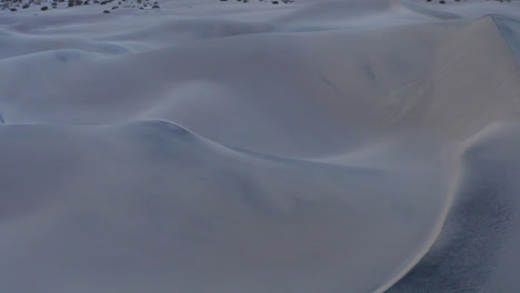 flying low over sand dunes