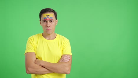 Dignified and serious man with ecuadorian flag painted on face