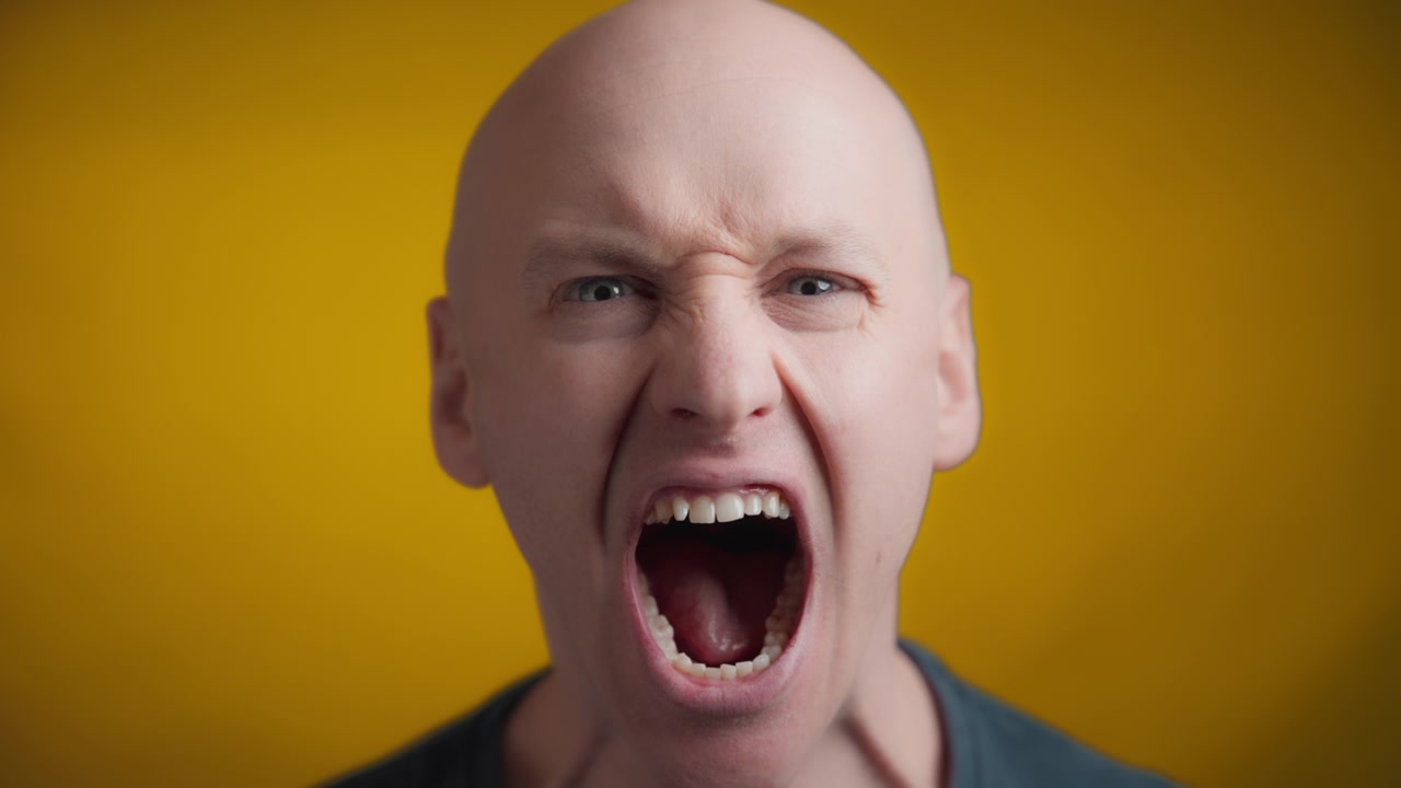 Adult man screaming with anger