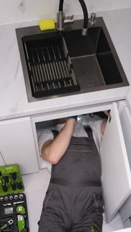 plumber repairing sink