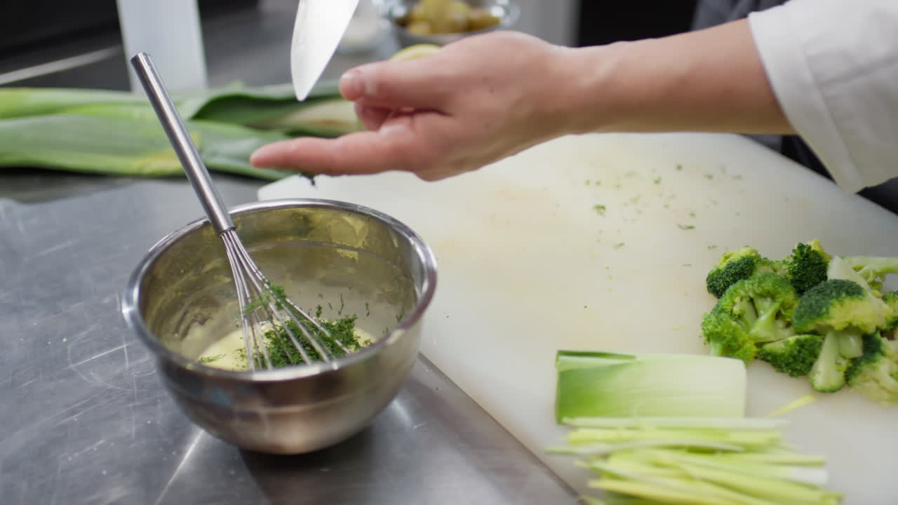 Chef Mixing Sauce with Dill