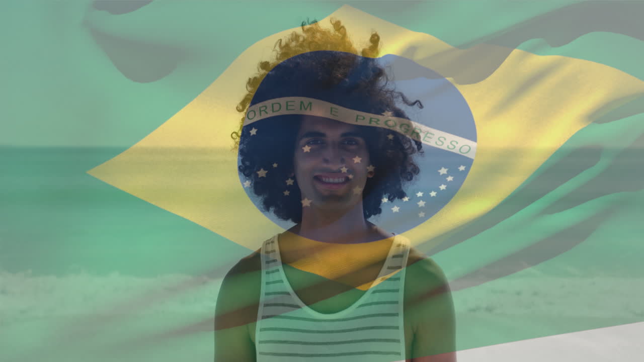 animazione di un uomo di due razze che sventola la bandiera del brasile in piedi contro l'oceano sulla spiaggia