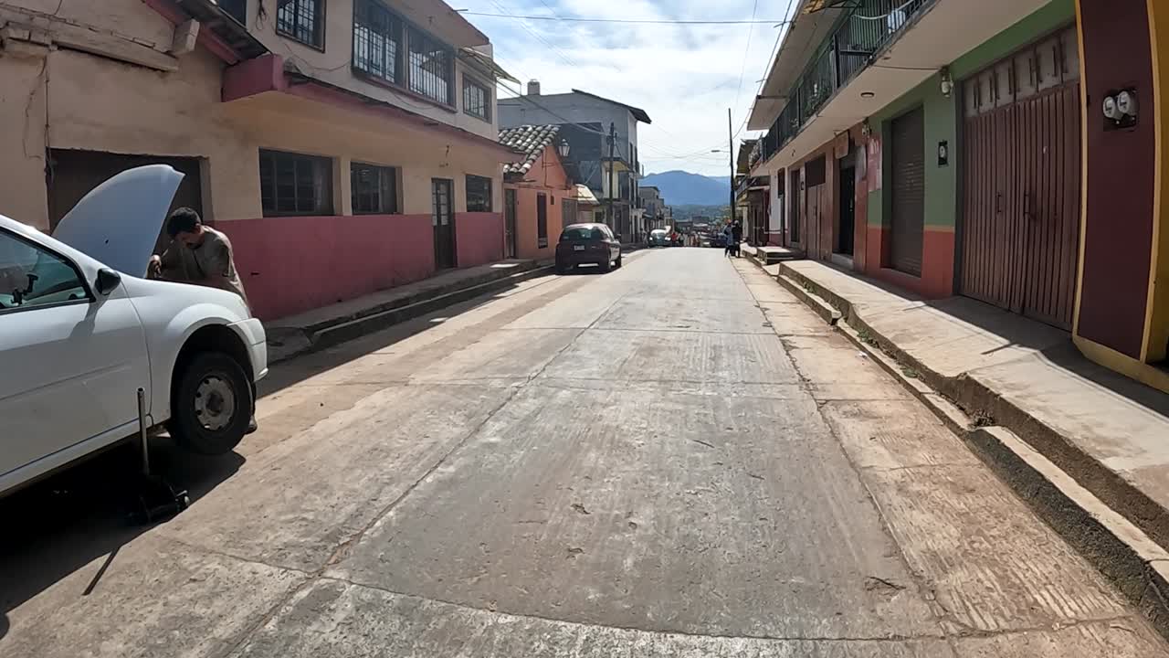 Car Repair on a Street in a Latin American Town