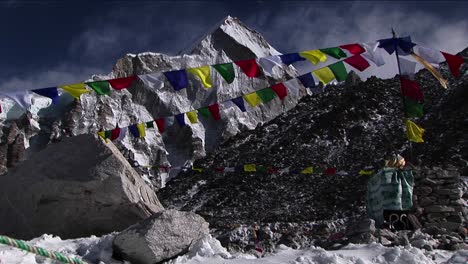 puja alter with prayer flags and mountain behind