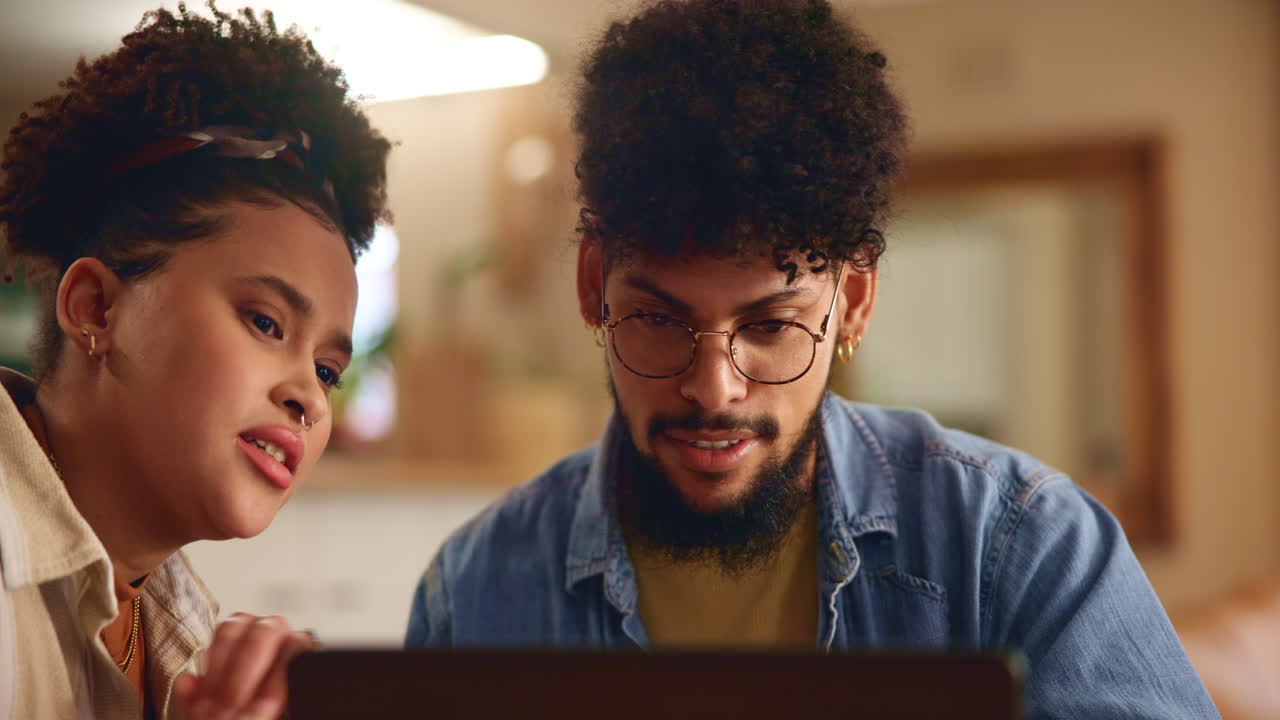 Couple Looking at Laptop Together