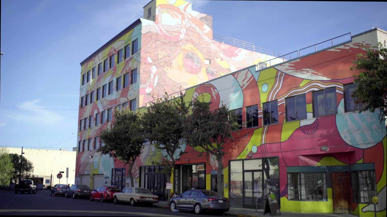 Colorful Mural-Covered Building in an Urban Setting
