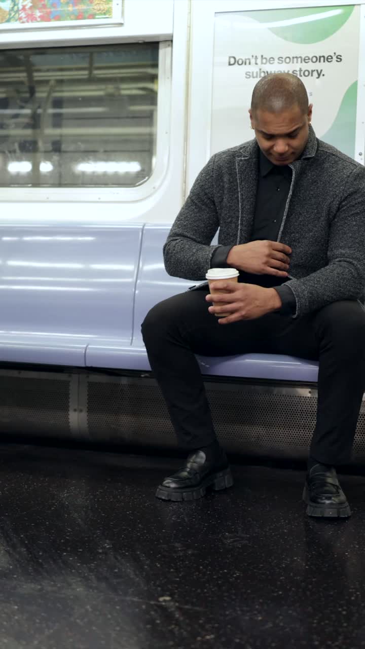 Man sitting in a subway train