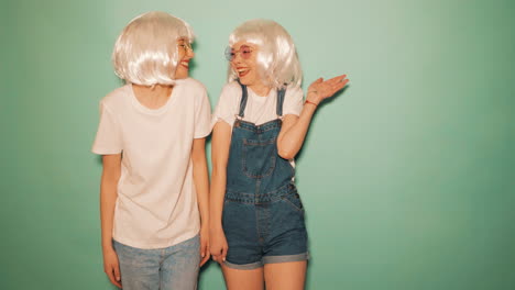 two young women in trendy outfits