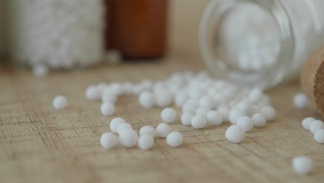 homeopathic pills in a glass bottle