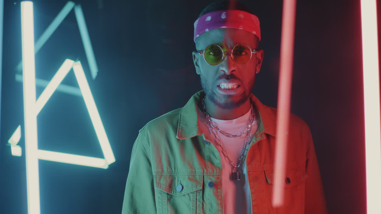 Stylish Man Posing in Neon Light