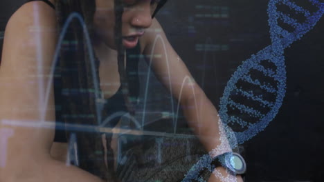 animation of dna strand and data processing over tired biracial woman