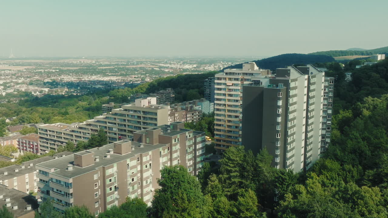 Aerial: Emmertsgrund neighborhood and buildings during the day in Heidelberg, state of Baden-Wurttemberg, Germany, orbit drone shot