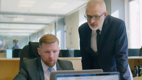 office worker speaking with senior manager