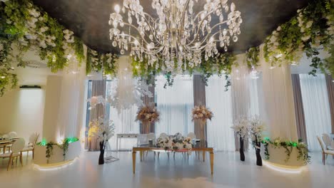 luxurious restaurant, interior, before party, ultra wide shot passing close to the chandelier