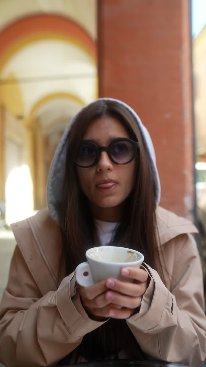 Woman enjoying coffee in an outdoor cafe