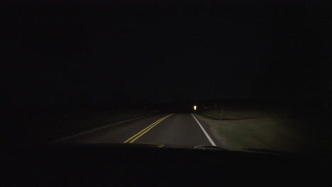 passenger pov on empty country road at night