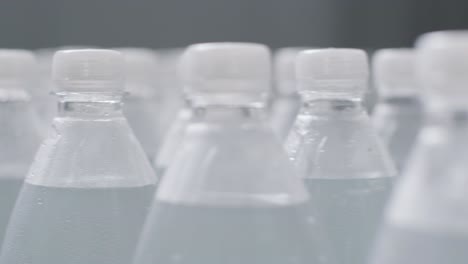 conveyor belt with bottles of drinking water at a modern beverage plant