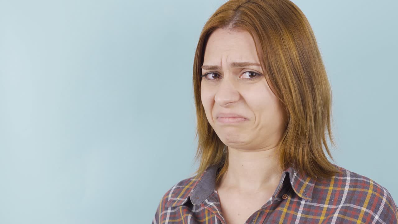 The woman is disgusted, looks at her with disgust.