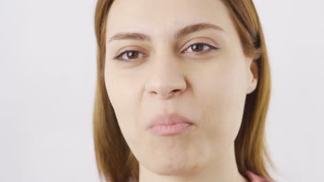 woman eating dried apricots in close-up. dry fruits.