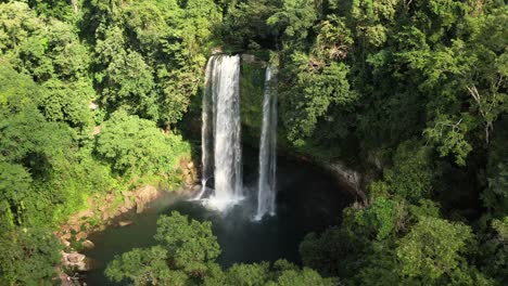 high aerial birds eye view pull back of misol ha waterfall in mexico