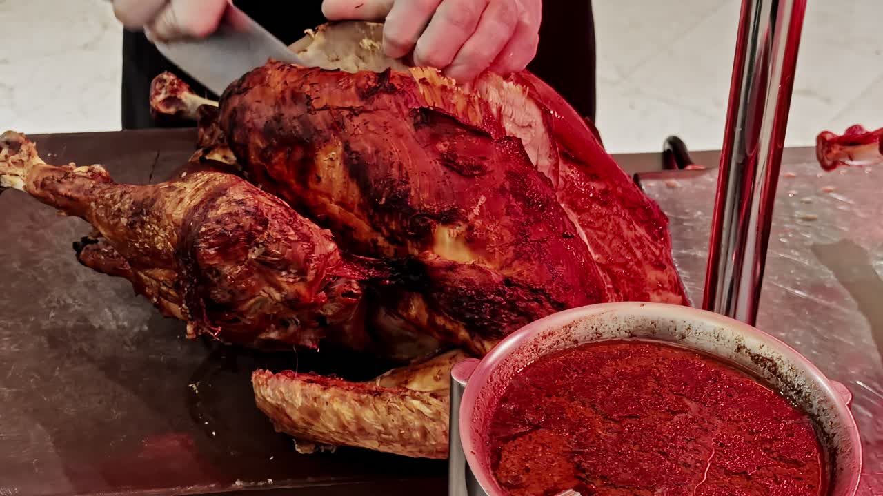 Slow-roasted turkey being expertly carved, showcasing rich seasoning, crispy skin, and juicy tenderness