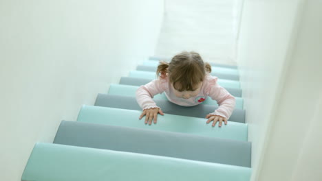 Cute-Funny-Little-Girl-Slide-Down-The-Staircase-in-slow-motion