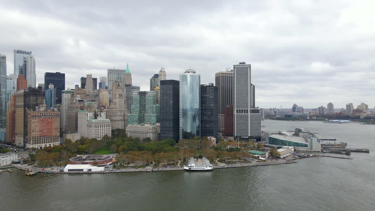 Aerial view of the lower Manhattan skyline, dark, overcast day, in New York, USA - tilt, drone shot
