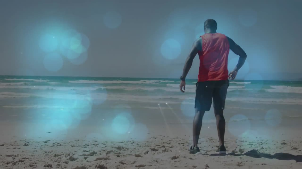 animación de un hombre afroamericano estirándose en la playa sobre puntos de luz