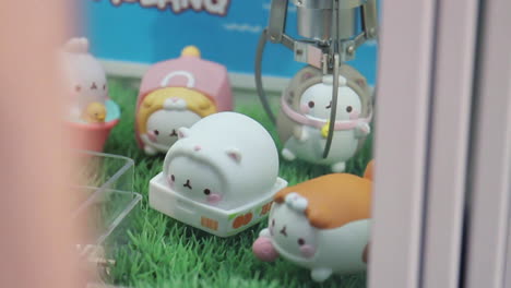 claw machine tries to grab toy in arcade seoul south korea