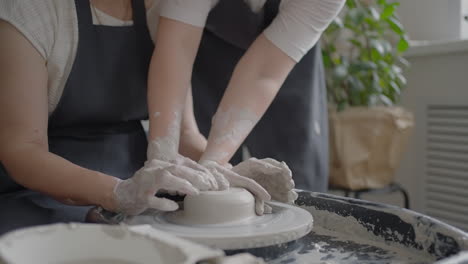 Close-up-of-a-male-master-working-on-a-potter's-wheel-close-up-in-slow-motion