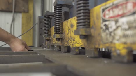 Metal Worker Cutting Aluminum On A Sheer, Industrial Manufacturing