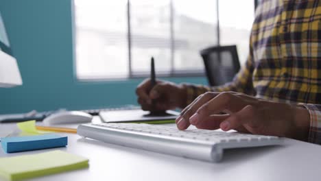 Mixed-race-man-working-at-the-office