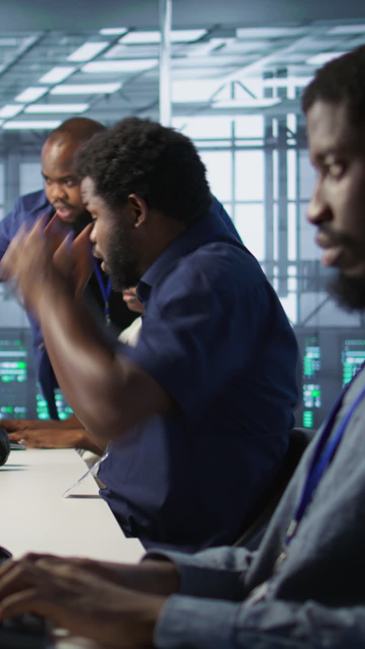 Vertical video Stressed data center workers frightened after seeing performance drop