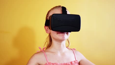 Schoolgirl-using-virtual-reality-glasses-in-classroom