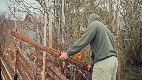 man building skigard in norway - close up