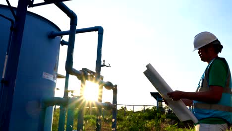 the male engineer is inspecting the sewage treatment system