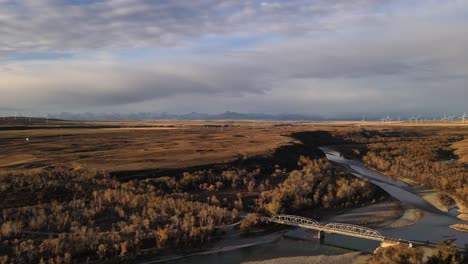 4k-aerial-footage-approaching-and-descending-towards-bridge-near-Brocket,-Alberta