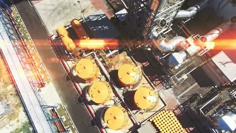 aerial view of petrol industrial zone, sun flare