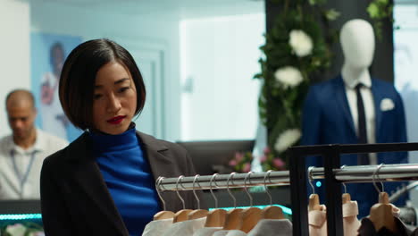 woman shopping for clothes in a modern retail store