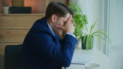 businessman breaks down over financials