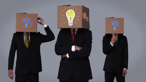 team of businessman hiding head with box and gesturing