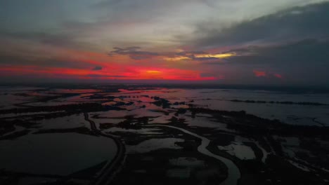 Breathtaking-twilight-sunset-over-wetland-with-flooded-river